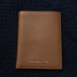 Brand New Michael Kors Passport wallet.